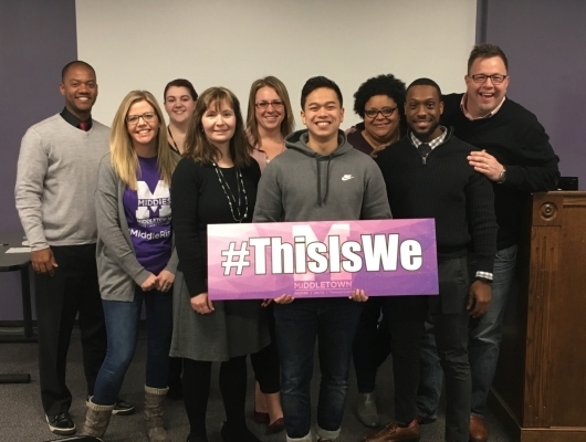 group holding #ThisIsWe sign