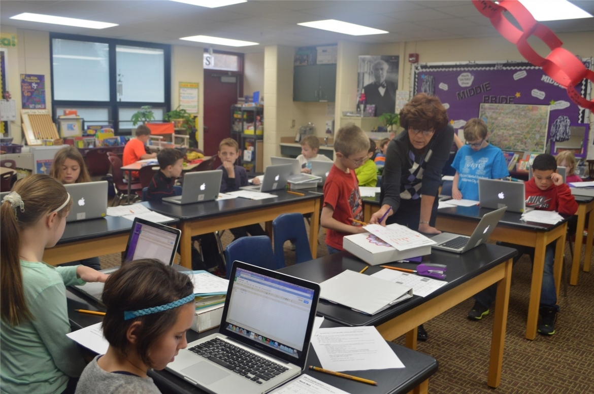 kids in classroom on laptops