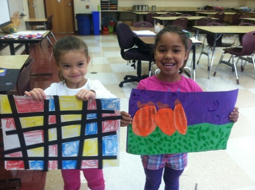 two girls holding art