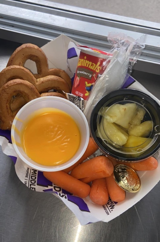 lunch basket with veggies and yogurt and pretzels