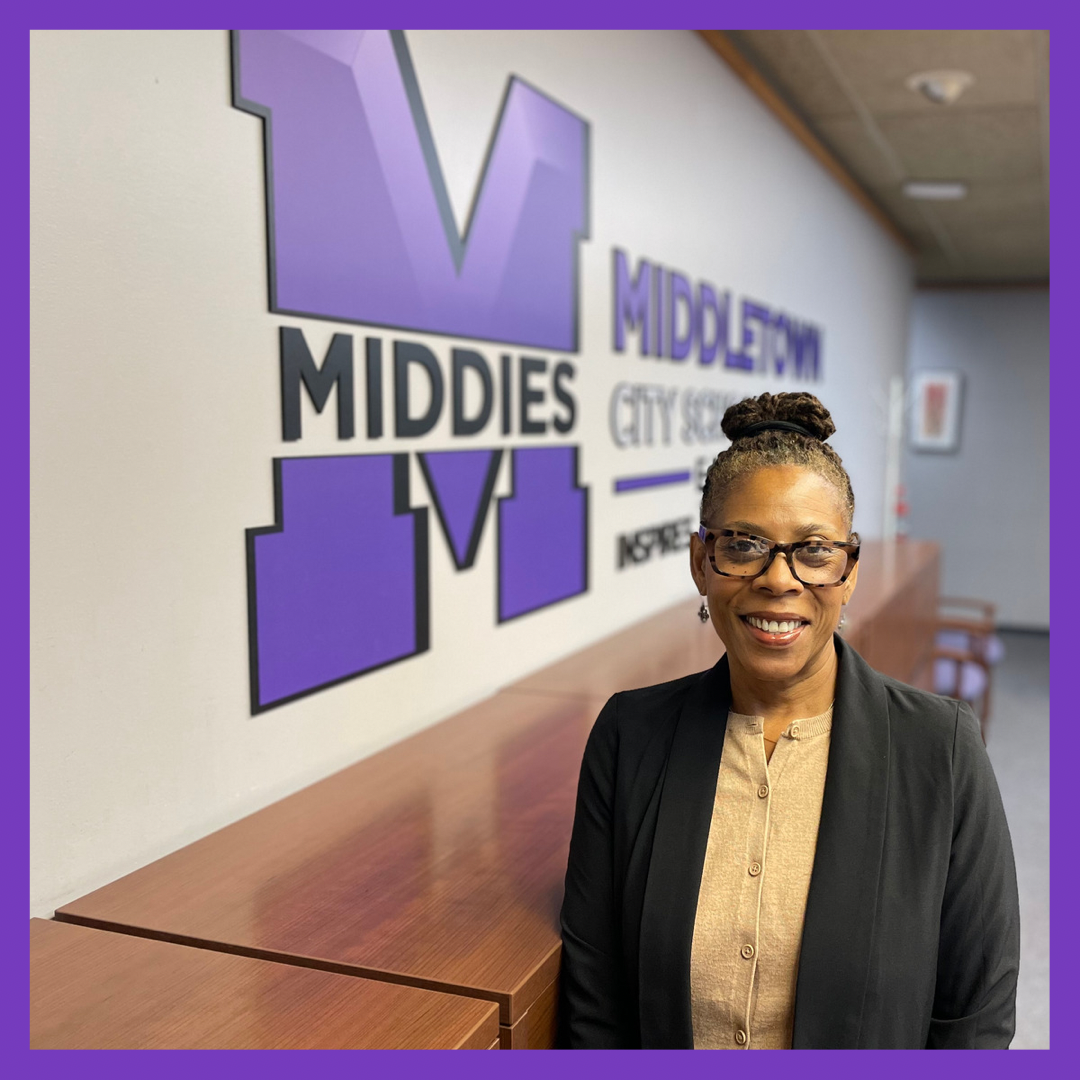 New BOE Member: Ms. Verlena Stewart standing in front of the MCSD logo, block M