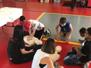 Students performing CPR