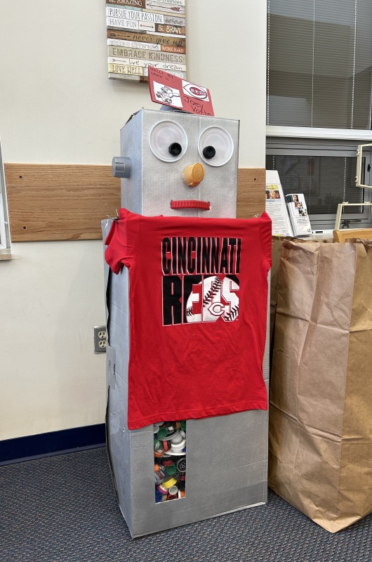 Recycling robot dressed in Cincinnati Reds gear