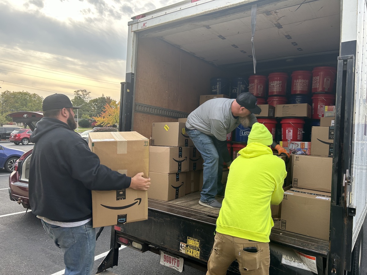 MCSD maintenance employees load supplies into box truck.