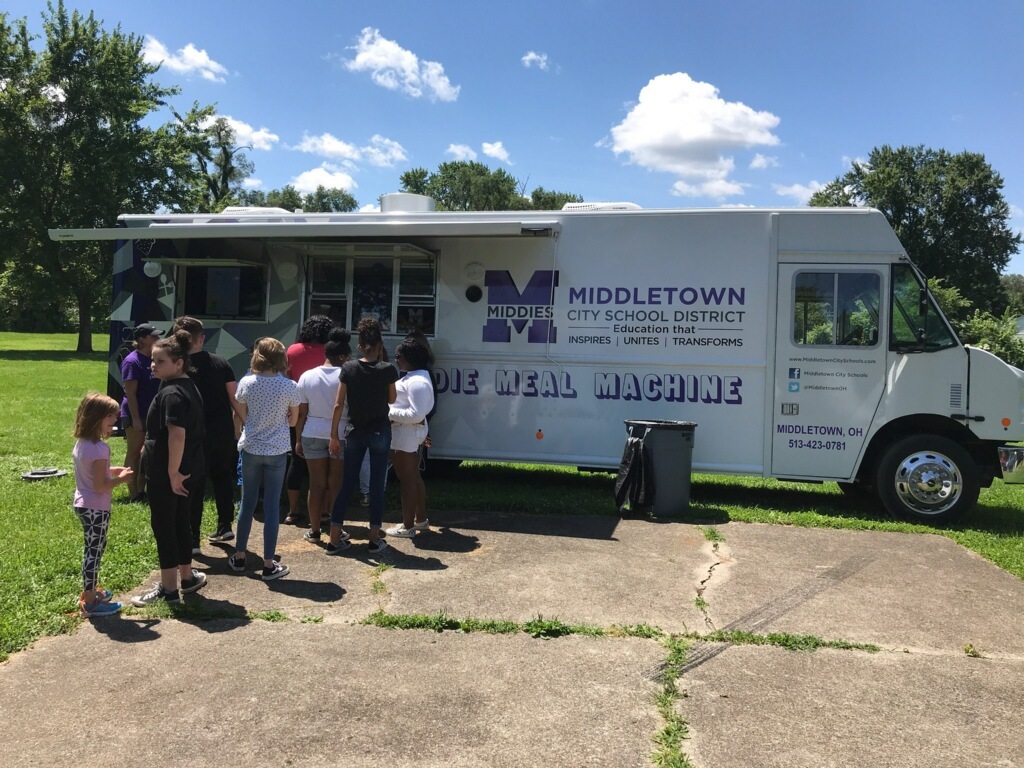 people in front of food truck