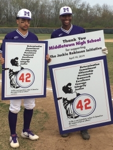 Baseball players holding signs