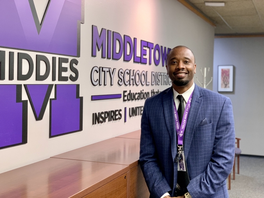 Mr. Kee Edwards in front Middletown School sign