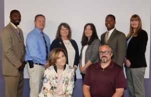 (Back, L-R) Kee Edwards, principal, Michael Valenti, principal, Debbie Sander, senior director of student services, Jenny Dennis, principal, Marlon J. Styles, Jr., superintendent, Melissa Prohaska, in