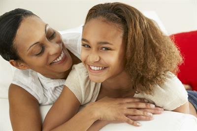 mom hugging daughter